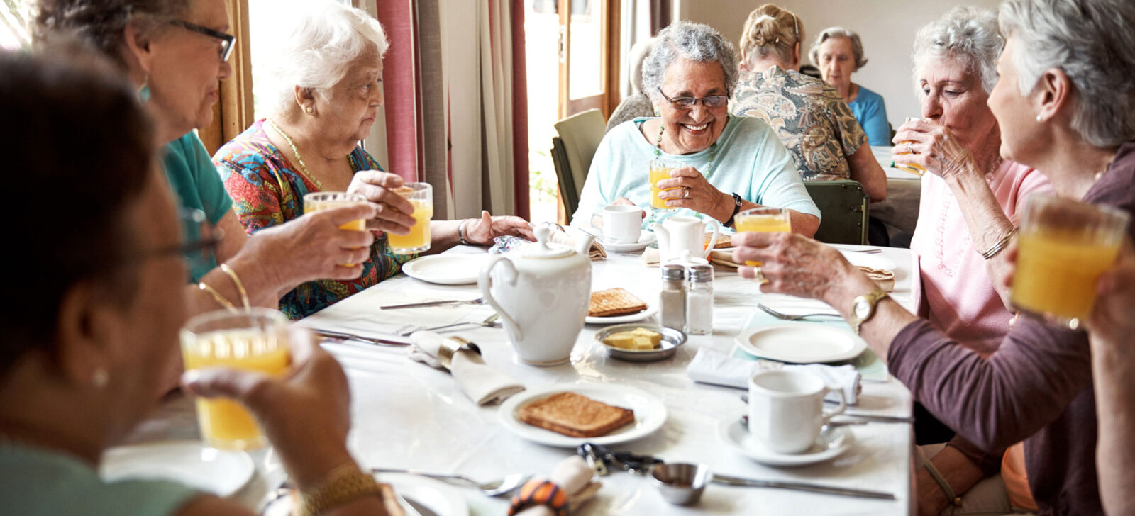 Senior ladies enjoying breakfast